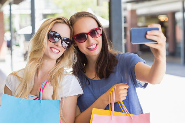 istock Happy smiling friends taking a selfie 692074556