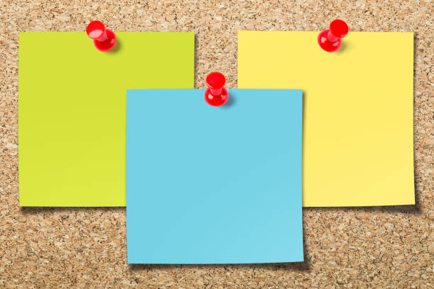 cork board with three sticky notes - adhesive note note pad message pad yellow imagens e fotografias de stock