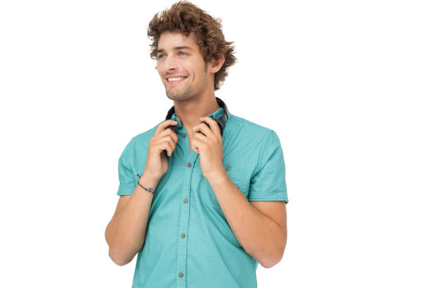 istock Smiling man with headphones looking away 692080362