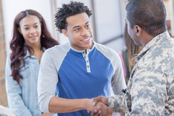 istock Young man greets military recruiter 692087900