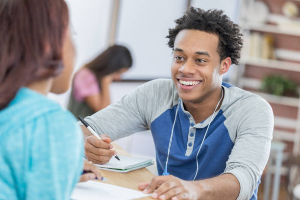 istock Male and female college students study in student lounge 692087946