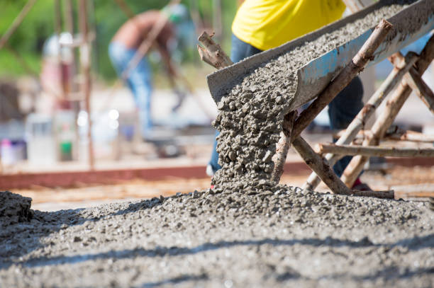 Concrete pouring during commercial concreting floors of building Concrete pouring during commercial concreting floors of building gravel photos stock pictures, royalty-free photos & images