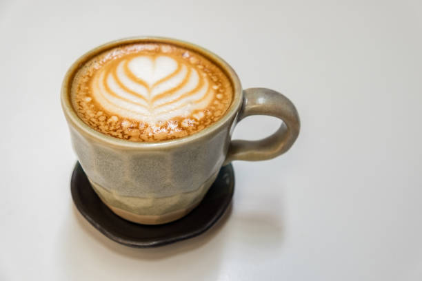 istock Cappuccino on wood background 692096762