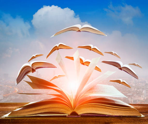 istock abstract of open book flying as knowledge wisdom going to future 692100166