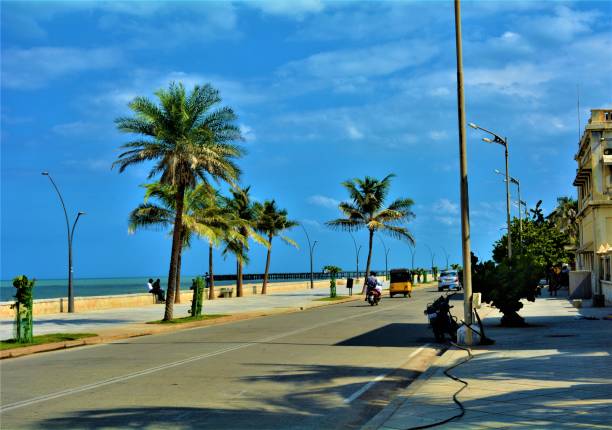 A street in the Pondicherry/Puducherry PUDUCHERRY, INDIA- 10th JUNE 2016: Street by the Promenade Beach during noon in Puducherry, India. tamil nadu landscape stock pictures, royalty-free photos & images