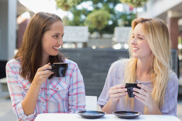 istock Happy women friends talking together 692103494