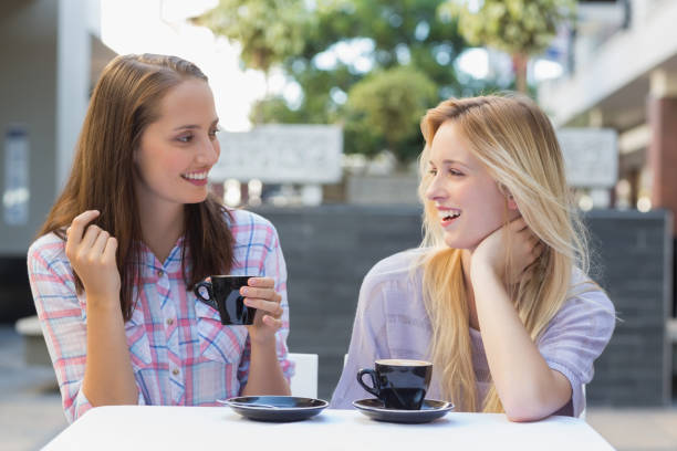 istock Happy women friends talking together 692103510