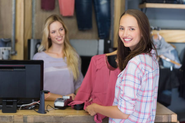 istock Pretty brunette doing shopping and smiling at camera 692106494
