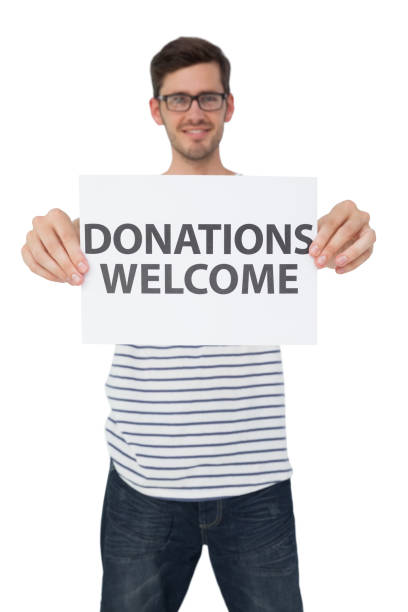 istock Portrait of a man holding a donation welcome note 692112524