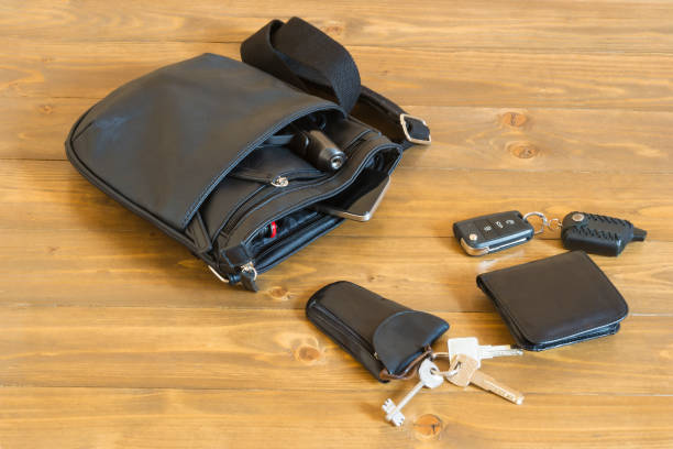 istock set of man's things from a black bag on a table 692113382