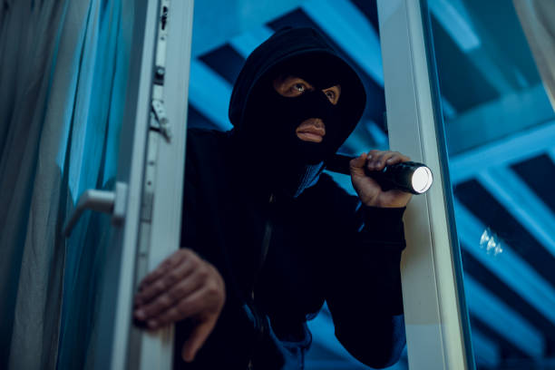 Robber Robber breaks house door thief stock pictures, royalty-free photos & images