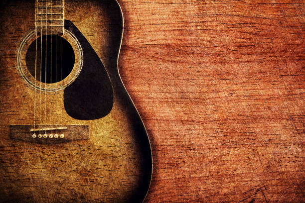 istock Guitar on wooden background vintage 692122222