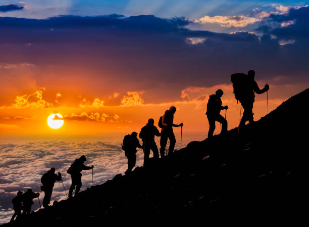 Silhouettes of hikers At Sunset