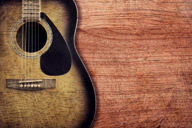istock Guitar on wooden background vintage 692128854