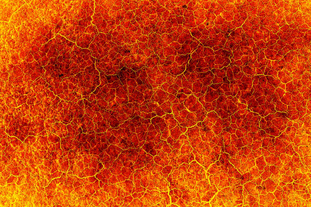 istock heat red cracked ground texture after eruption volcano 692129106
