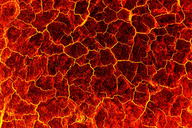 istock heat red cracked ground texture after eruption volcano 692129162