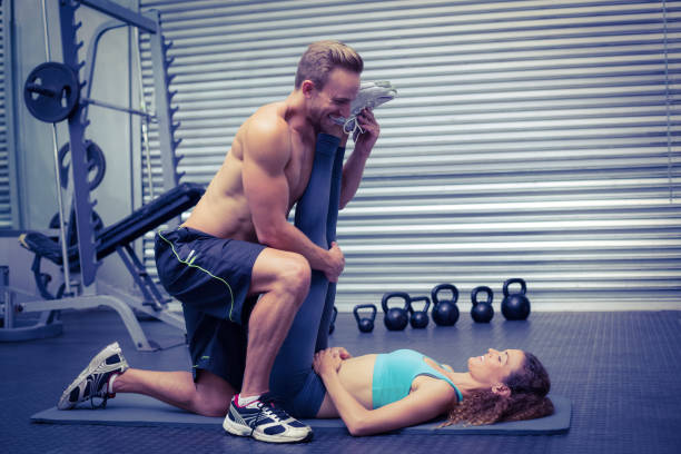 istock Muscular couple doing a leg stretching 692132070
