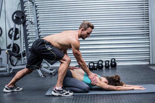 istock Muscular couple doing a body stretching 692132260