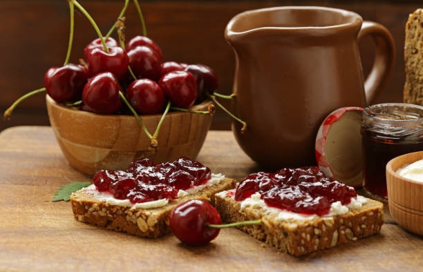 istock Sandwich with cherry jam and soft cheese 692132556