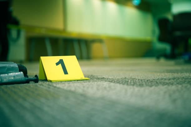 evidence marker number 1 on carpet floor near suspect object in crime scene investigation and copy space evidence marker number 1 on carpet floor with suspect object in crime scene investigation with copy space and cinematic tone distance marker stock pictures, royalty-free photos & images