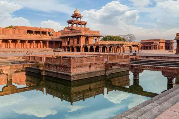 istock Fatehpur Sikri Anup Talao - a classic red sandstone architectural structure with a pool connected with four bridges used for Medieval concerts. 692142796