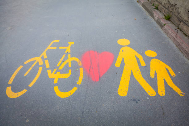 istock Bicycle signs painted on asphalt 692143338