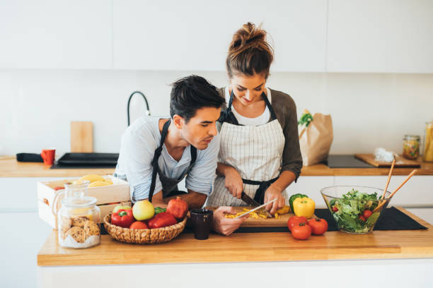 istock Young couple cooking in the kitchen 692145780