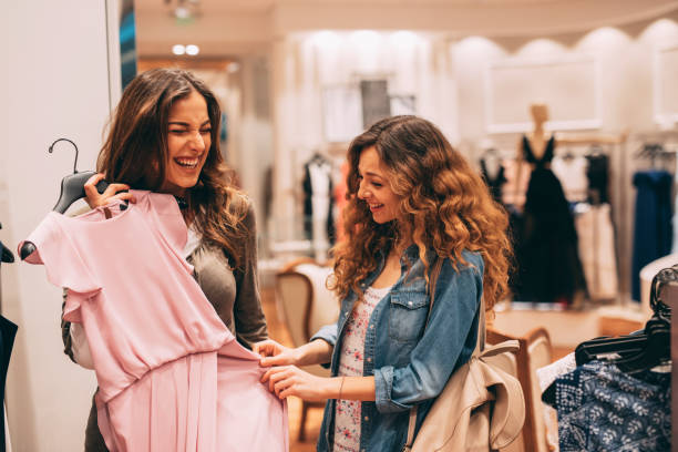istock Two friends shopping for clothes 692145810