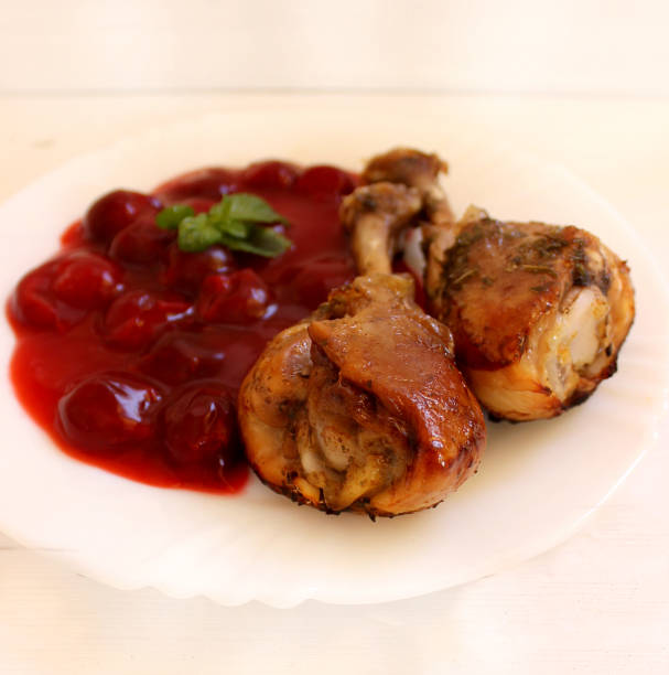 istock Chicken legs baked with cherry sauce 692147162