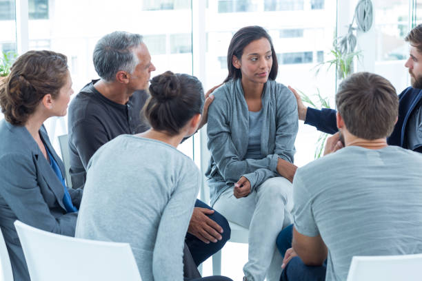 istock Concerned men comforting another in rehab group 692151440
