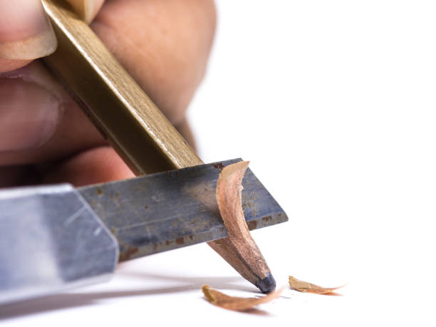 istock sharpened wooden pencil by cutter knife  close-up on white background 692158412