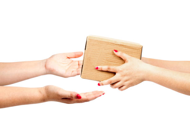 istock hand holding box to someone on white background 692165136