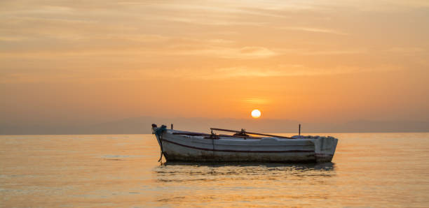istock Row boat and sunrise 692165440
