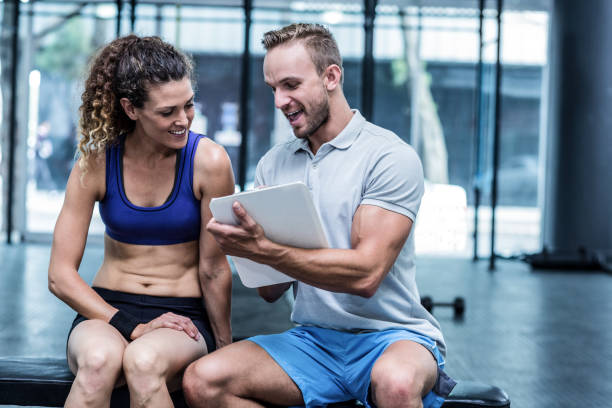 istock Muscular woman watching her results on clipboard 692169344
