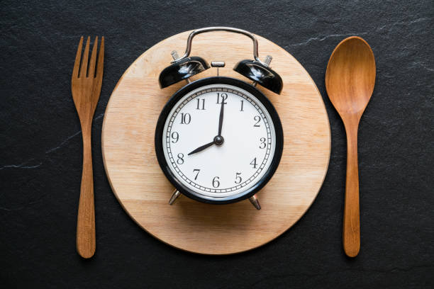 istock Meal time with alarm clock at breakfast time 692171772