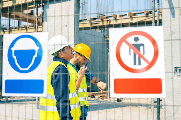 Construction site warning signs Engineer and construction site manager dealing with blueprints and projects. Construction site warning signs construction zone signs stock pictures, royalty-free photos & images