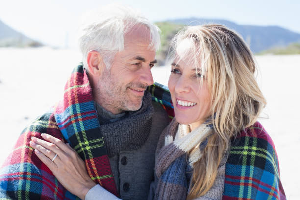 istock Married couple at the beach together 692173042
