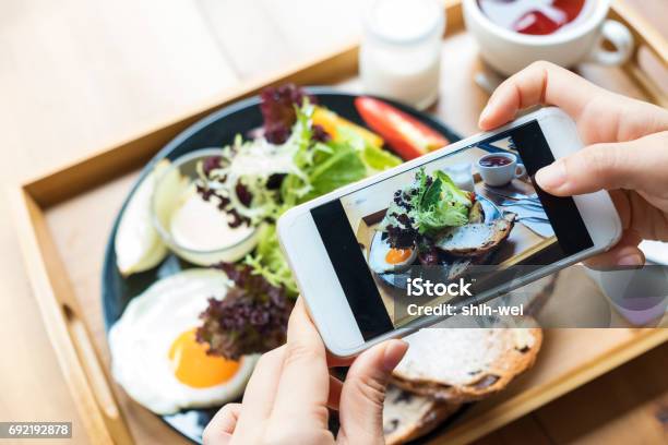 Closeup Hand Holding Phone Shooting Food Photograph Stock Photo - Download Image Now