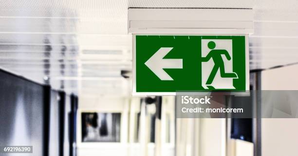 Exit Sign Stock Photo - Download Image Now - Arrow Symbol, Close-up, Corridor