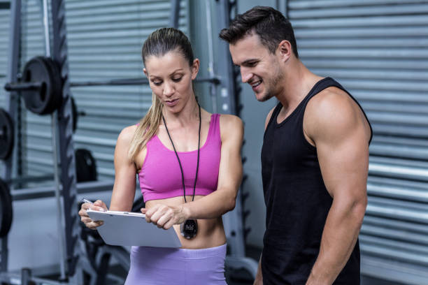 istock Female coach showing results to an athlete 692200906