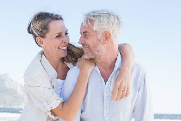istock Attractive married couple hugging at the beach 692201046