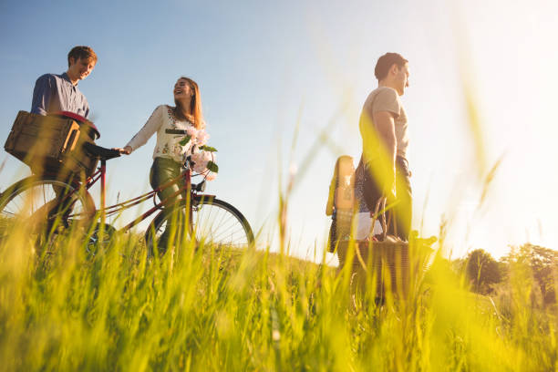 family picnic in rural scene with bicycles