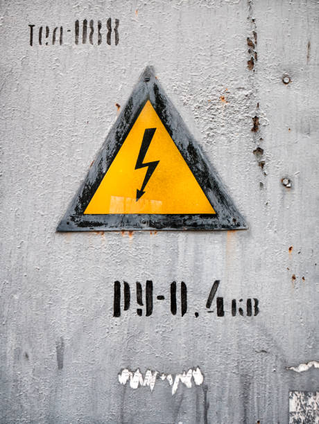 istock Electric shock hazard sign on rusty metal surface. 692211116