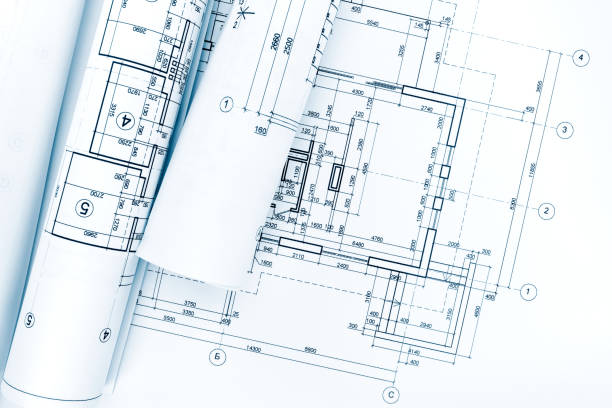 istock rolls of architectural blueprints and technical drawings on architect workplace 692220846