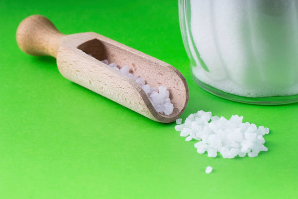 istock salt crystals with wooden spoon 692227502