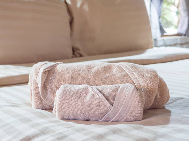 istock Brownish color towel on bed 2 692228806