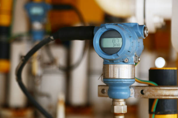 istock Pressure transmitter in oil and gas process, Send signal to controller and reading pressure in the system, Electronic transducer and sent data from production process to Processor Logic Controller. 692233928