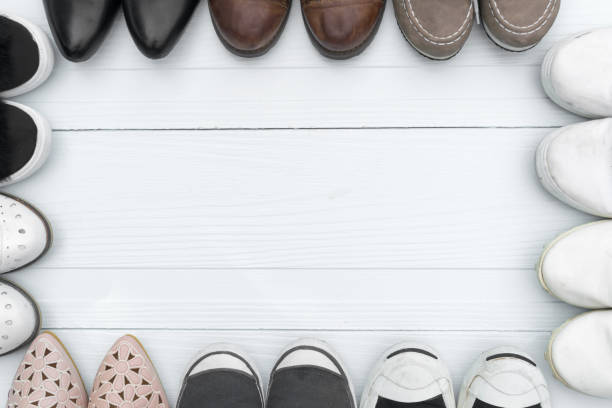 istock shoes are placed on a white wooden floor. 692234554