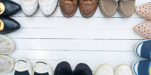 istock shoes are placed on a white wooden floor. 692234616