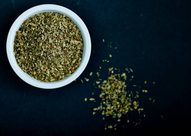 istock Dried oregano herbs in white bowl 692237414